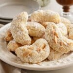 Italian amaretti cookies on a white plate.