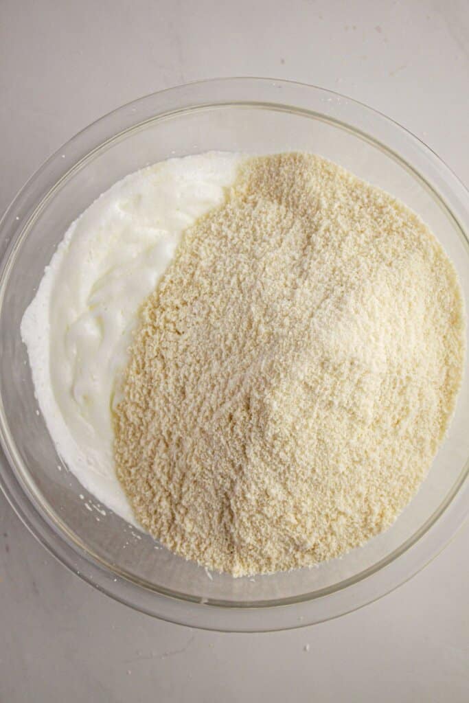 Dry ingredients being mixed into wet ingredients.