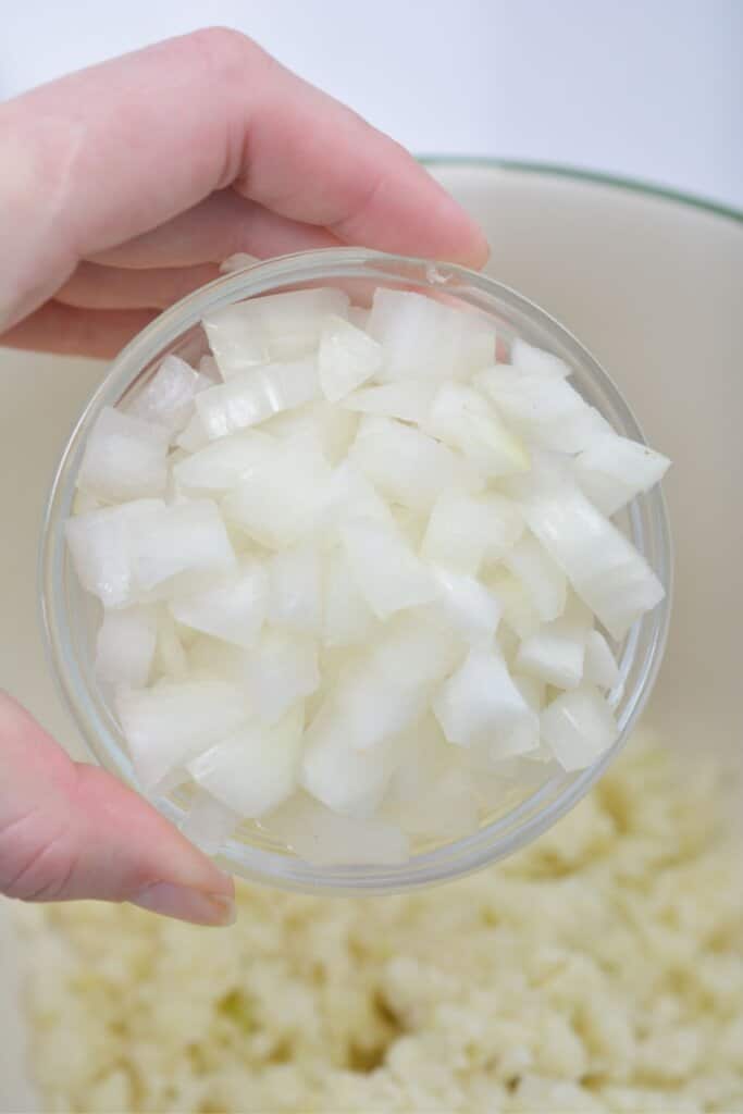 Onions are being added to the pot.