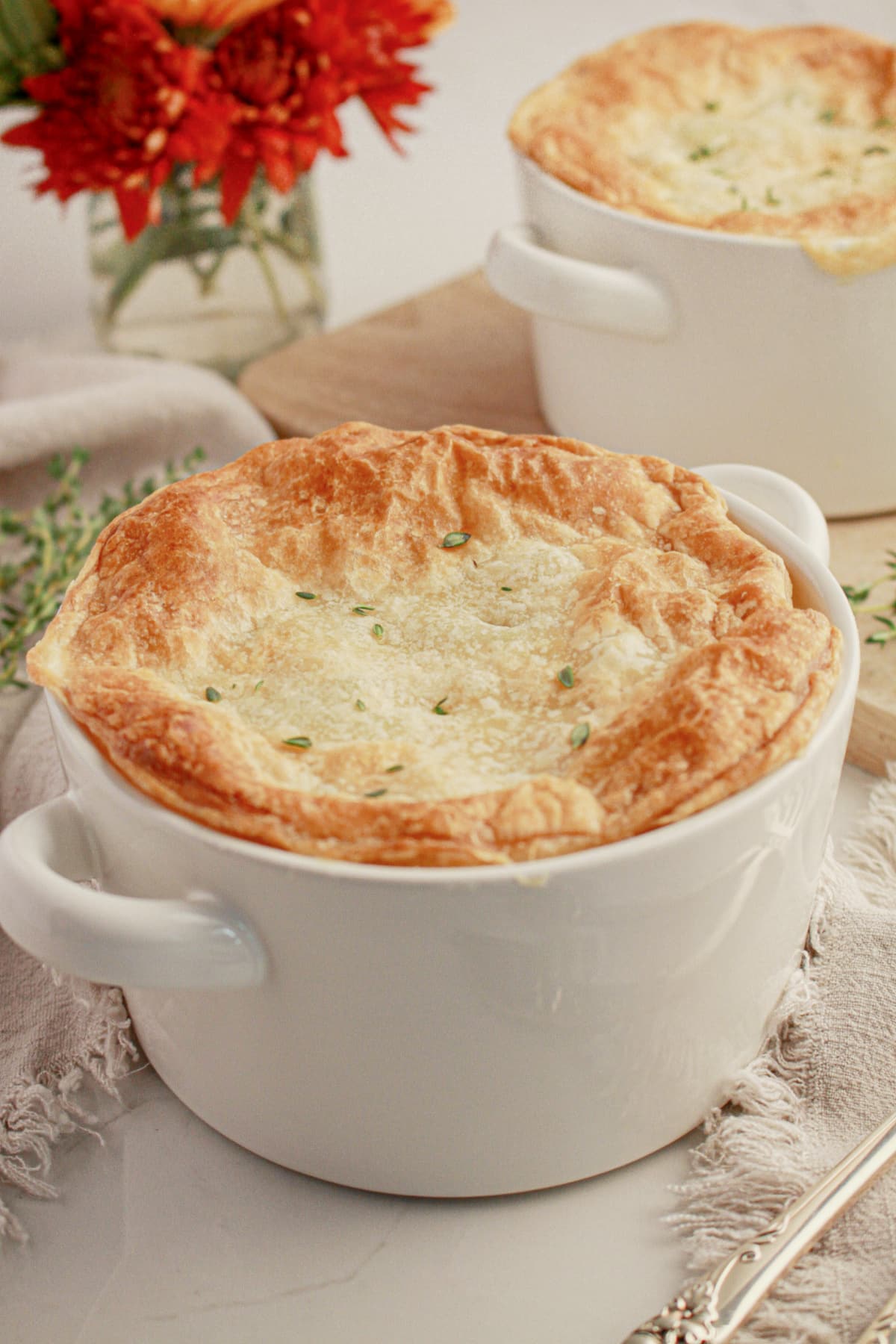 Chicken pot pie in a white bowl.