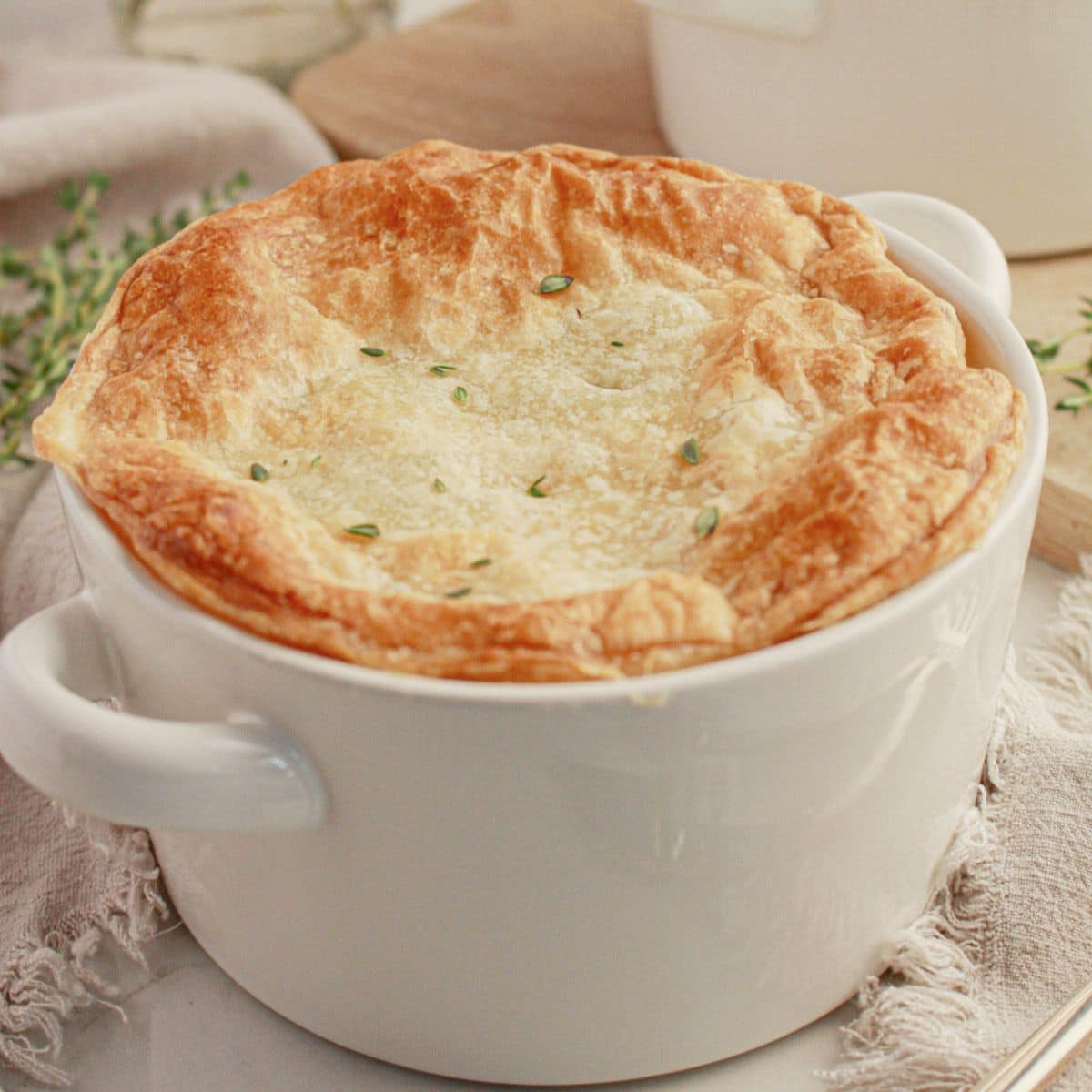 Chicken pot pie in a white bowl.
