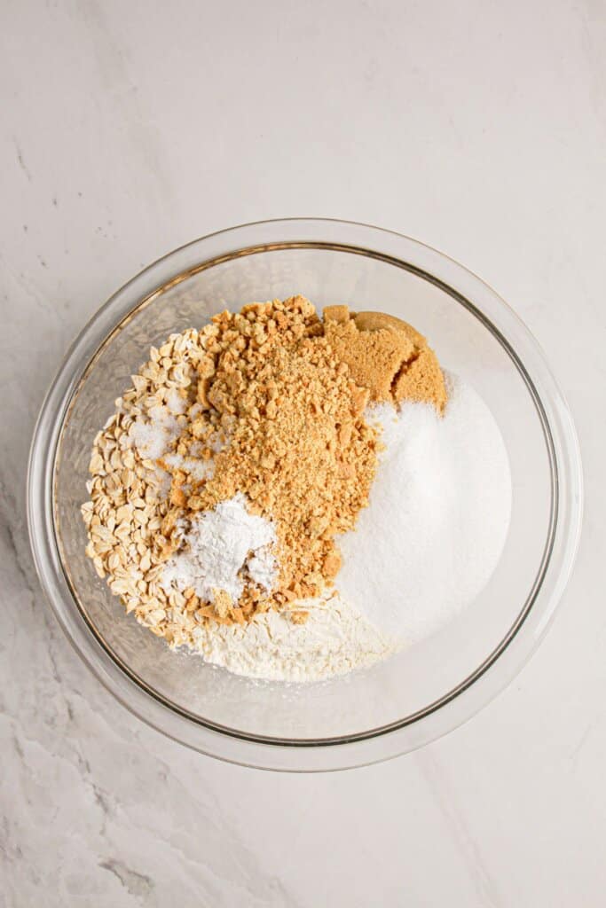 Crust ingredients being mixed in a glass mixing bowl.