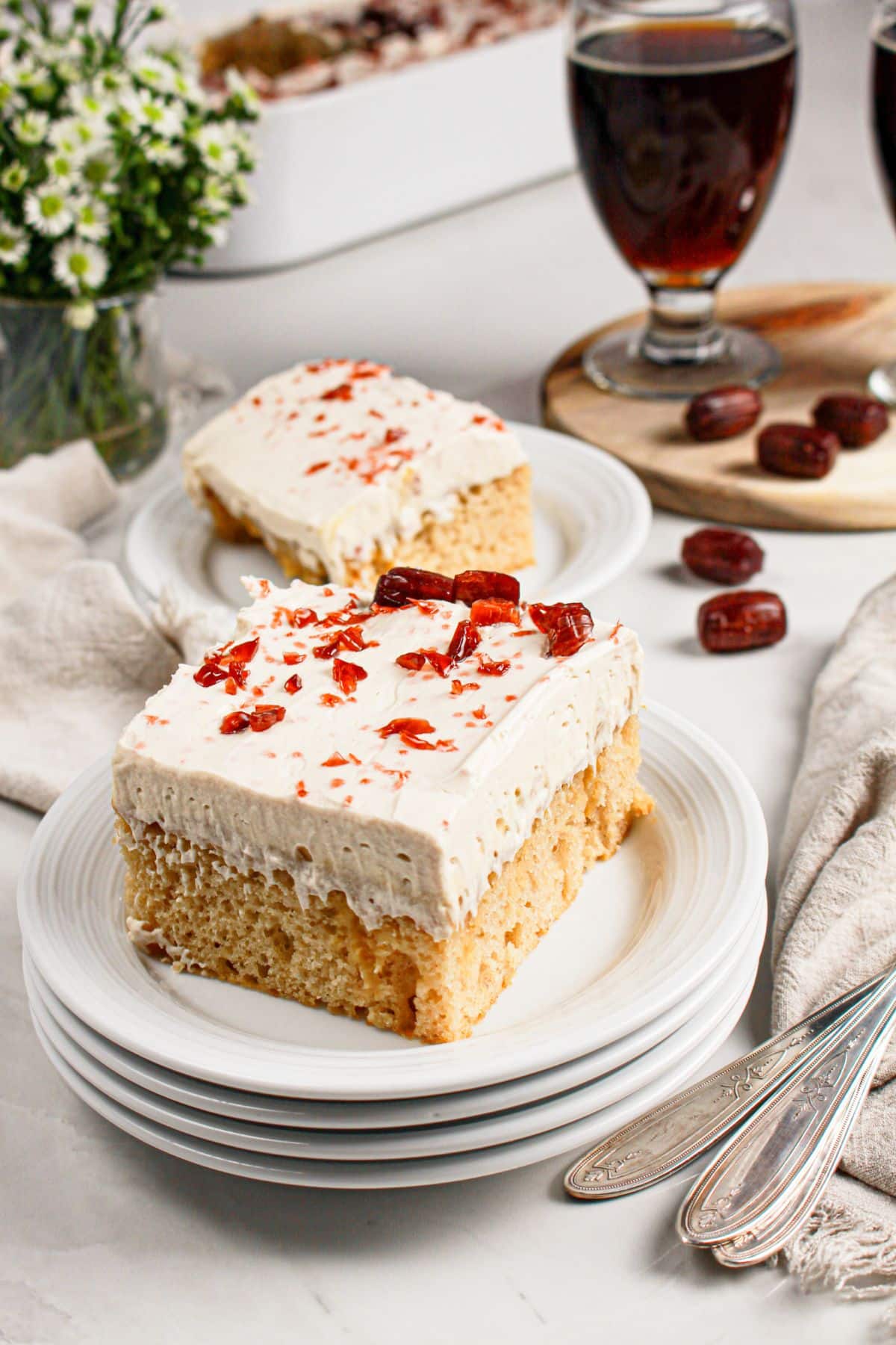 Slice of root beer float cake on a plate.
