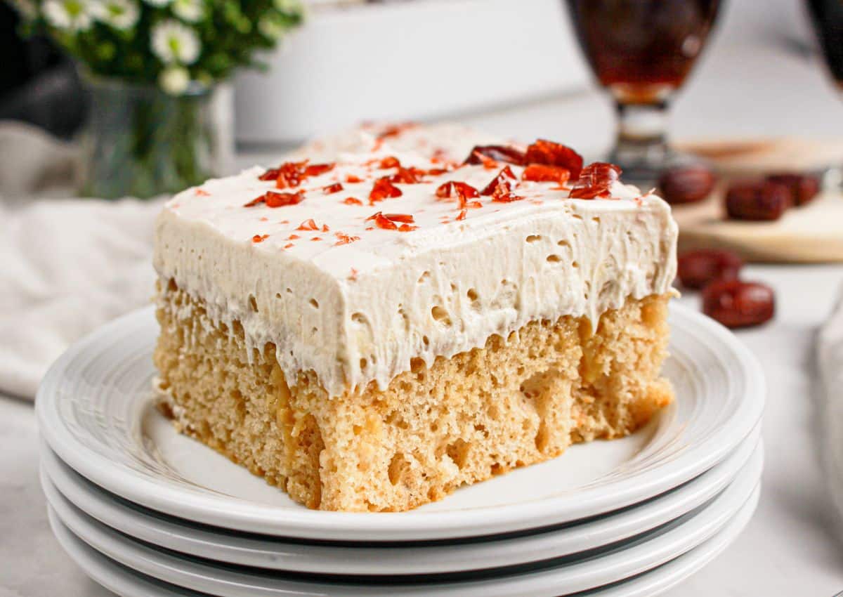Slice of root beer float cake on a plate.