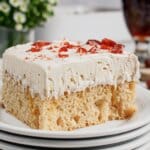 Slice of root beer float cake on a plate.