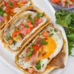 Sausage tacos on a serving platter.