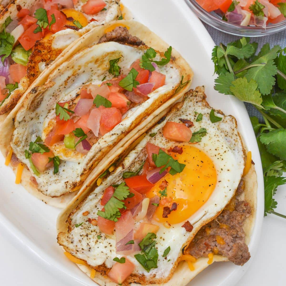 Sausage tacos on a serving platter.
