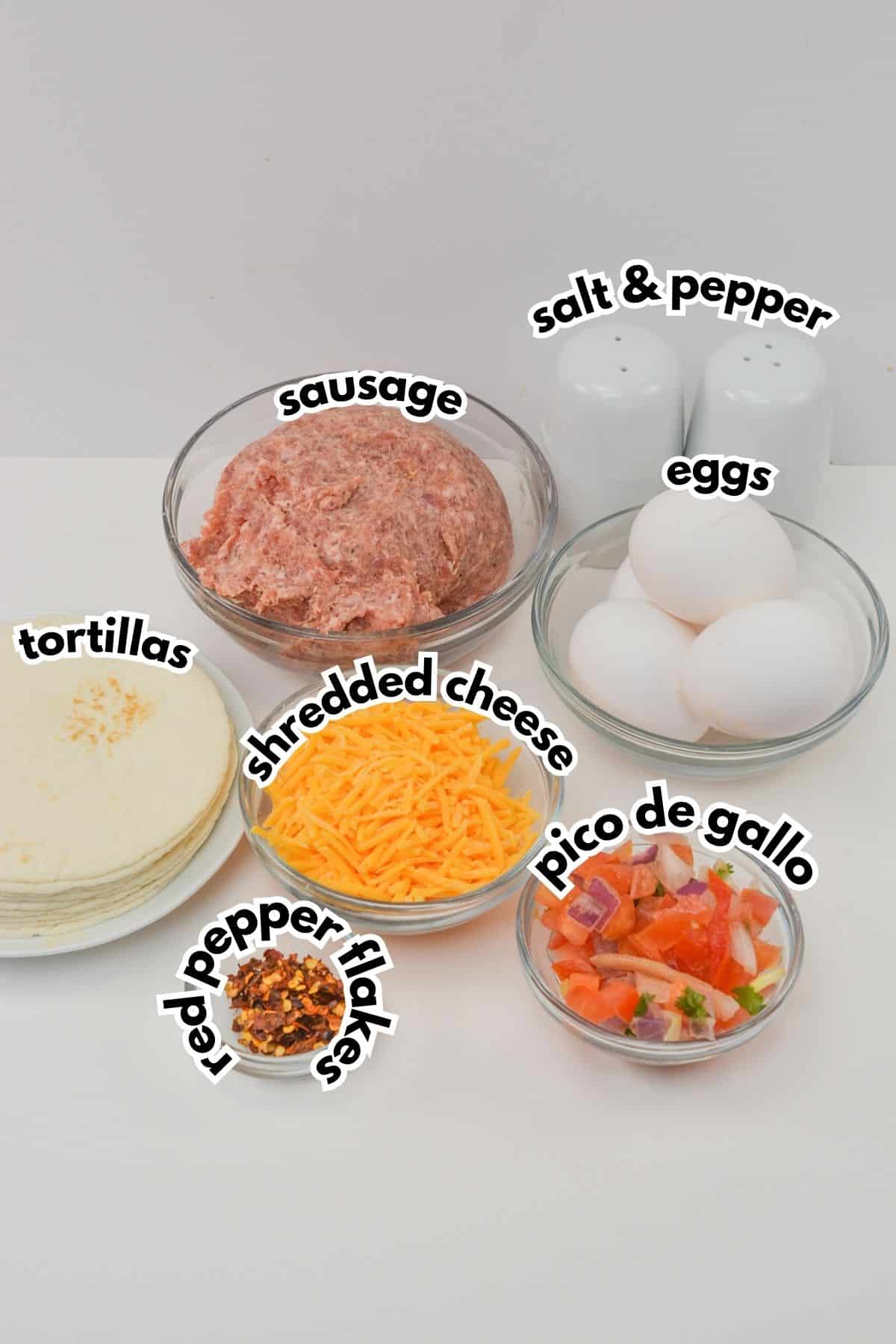 Bowls of ingredients labelled with text on a counter.