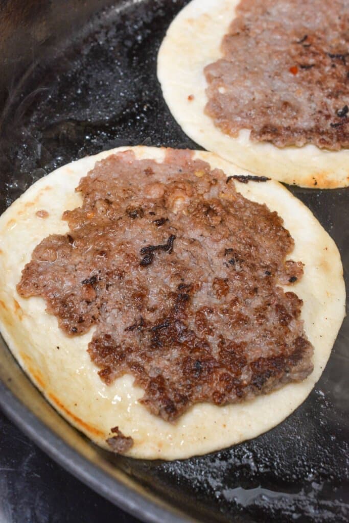 Sausage on a flour tortilla.