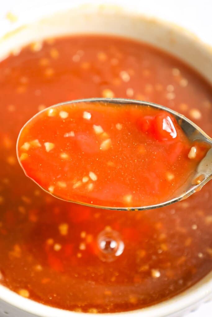 Sauce being mixed in a bowl.