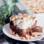 Slice of smores brownies on a plate.