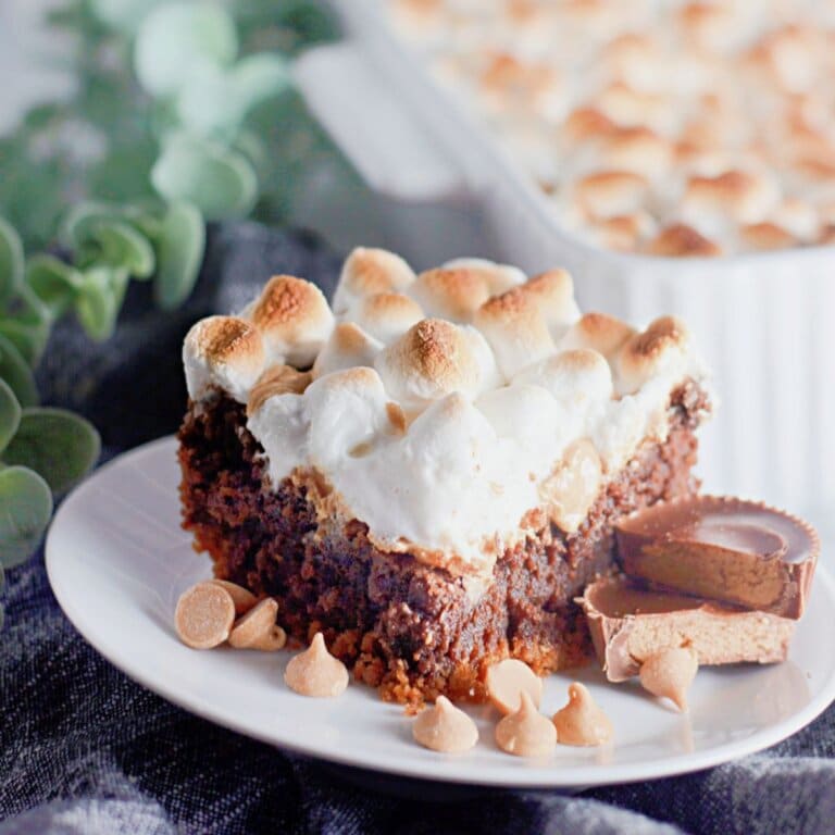 Slice of smores brownies on a plate.
