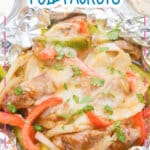 Steak fajitas foil packet on a plate.