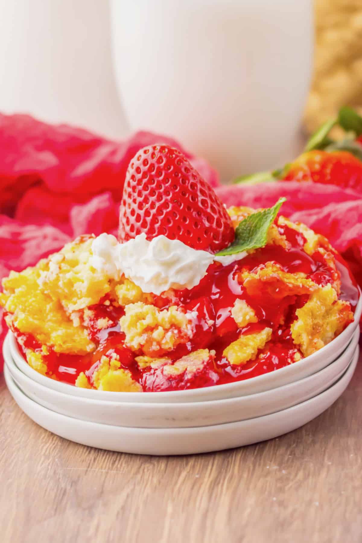 Strawberry cheesecake dump cake on a small plate.