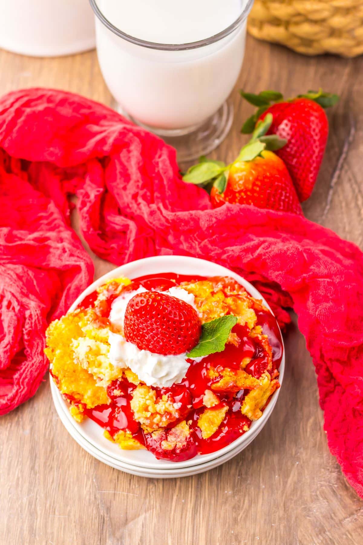 Strawberry cheesecake dump cake on a small plate.