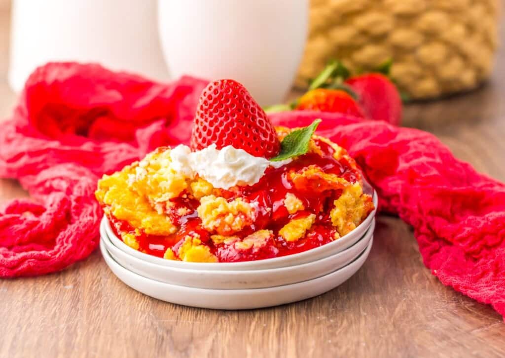 Strawberry cheesecake dump cake on a small plate.