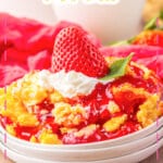 Strawberry cheesecake dump cake on a small plate.