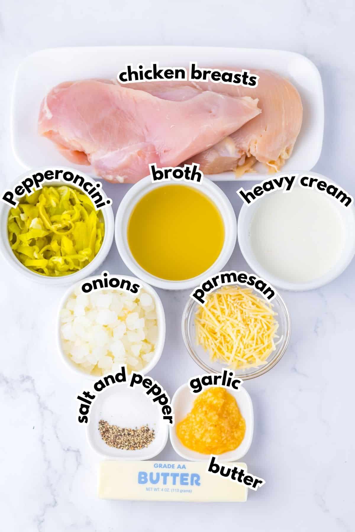 Bowls of ingredients labelled with text on a counter.