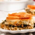Slice of spanakopita on a plate.