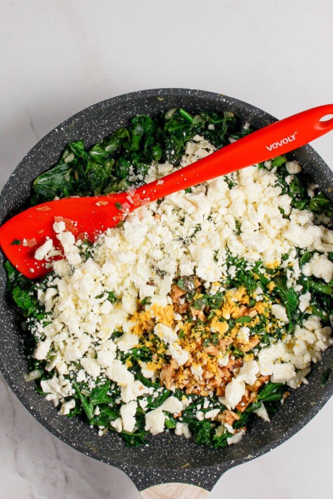 Feta cheese in a large skillet.