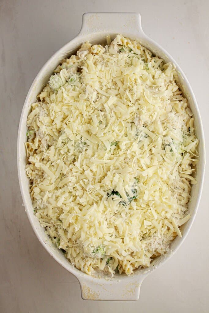 Cheese on top of a baking dish ready for the oven.