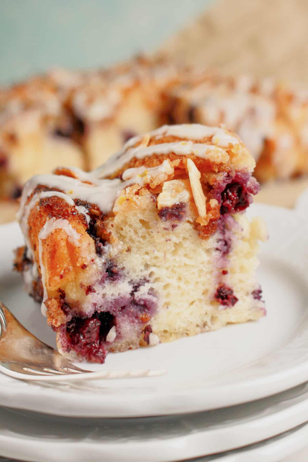 Slice of blueberry butter swim biscuits on a plate.