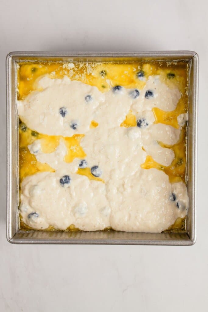 Batter being poured into a baking dish.