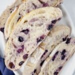 Slices of blueberry sourdough bread on a platter.