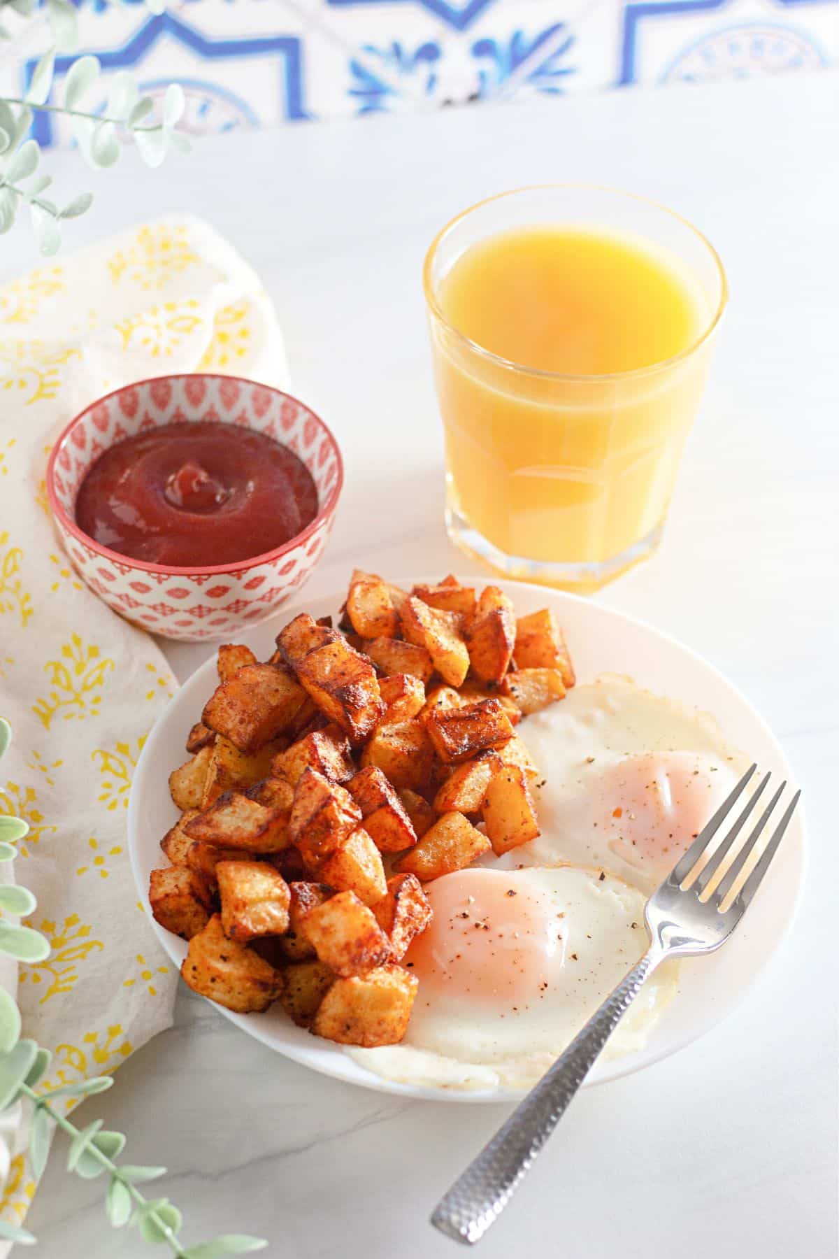 Diced potatoes and eggs on a plate.