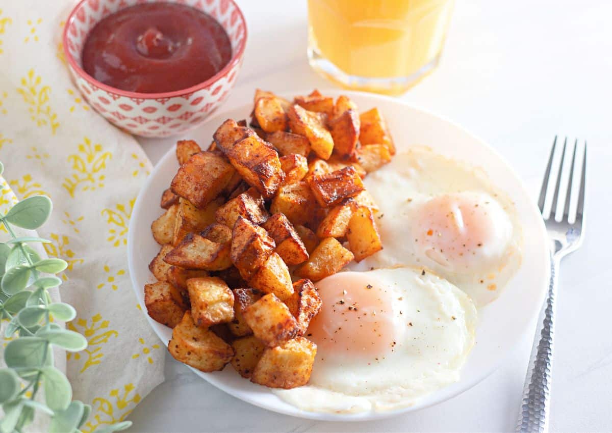 Diced potatoes and eggs on a plate.