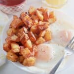 Diced potatoes and eggs on a plate.