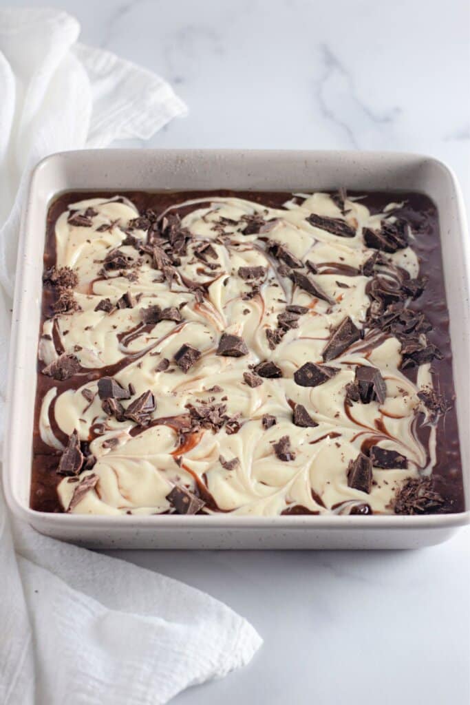 Batter in a metal baking pan ready for the oven.