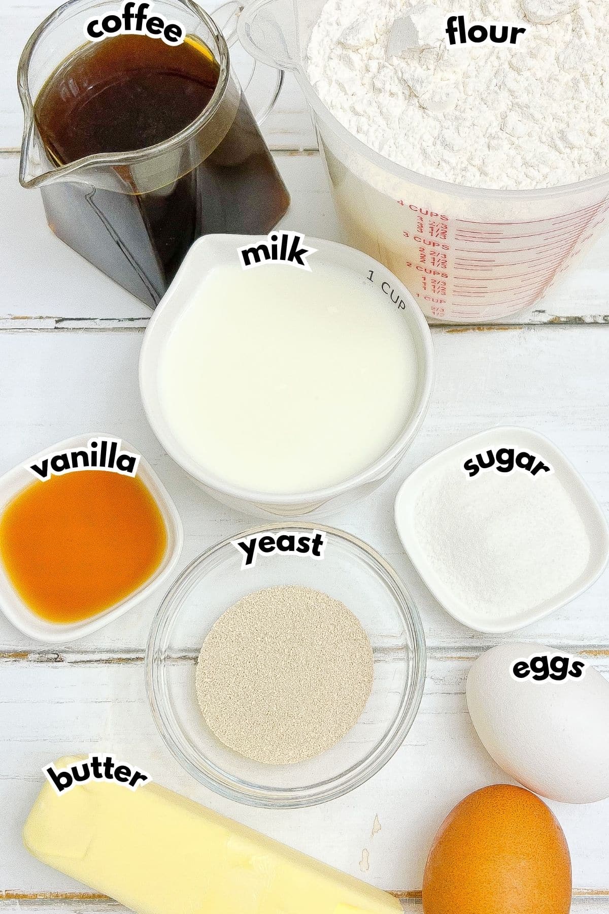 Ingredients on a counter labelled with text. 