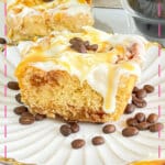 Coffee cinnamon roll on a plate.