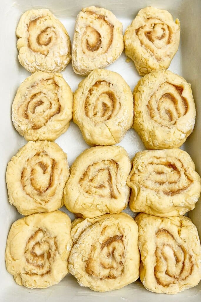 Cinnamon rolls in a baking dish.