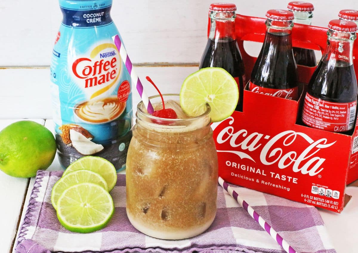 Jar full of dirty coke drink.