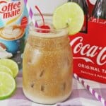 Jar full of dirty coke drink.