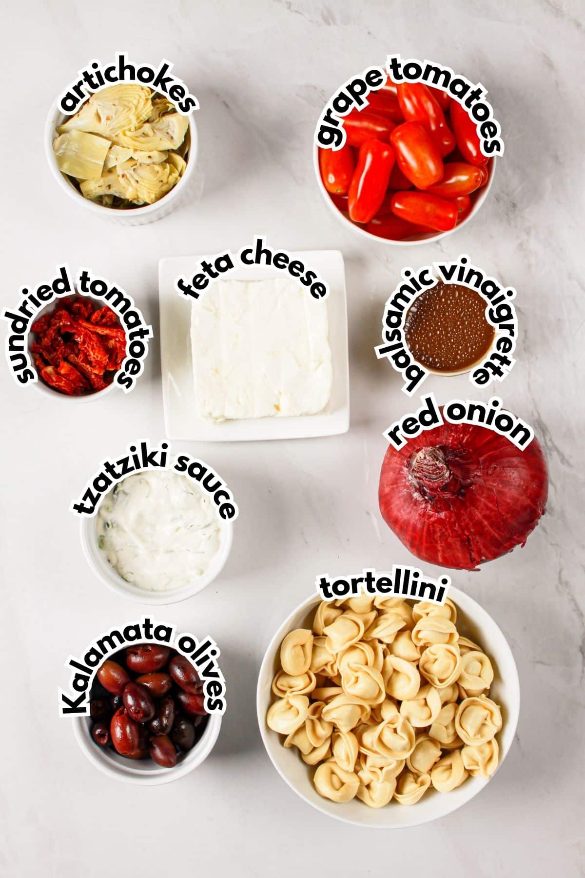 Bowls of ingredients on a counter ready to cook, labelled with text.