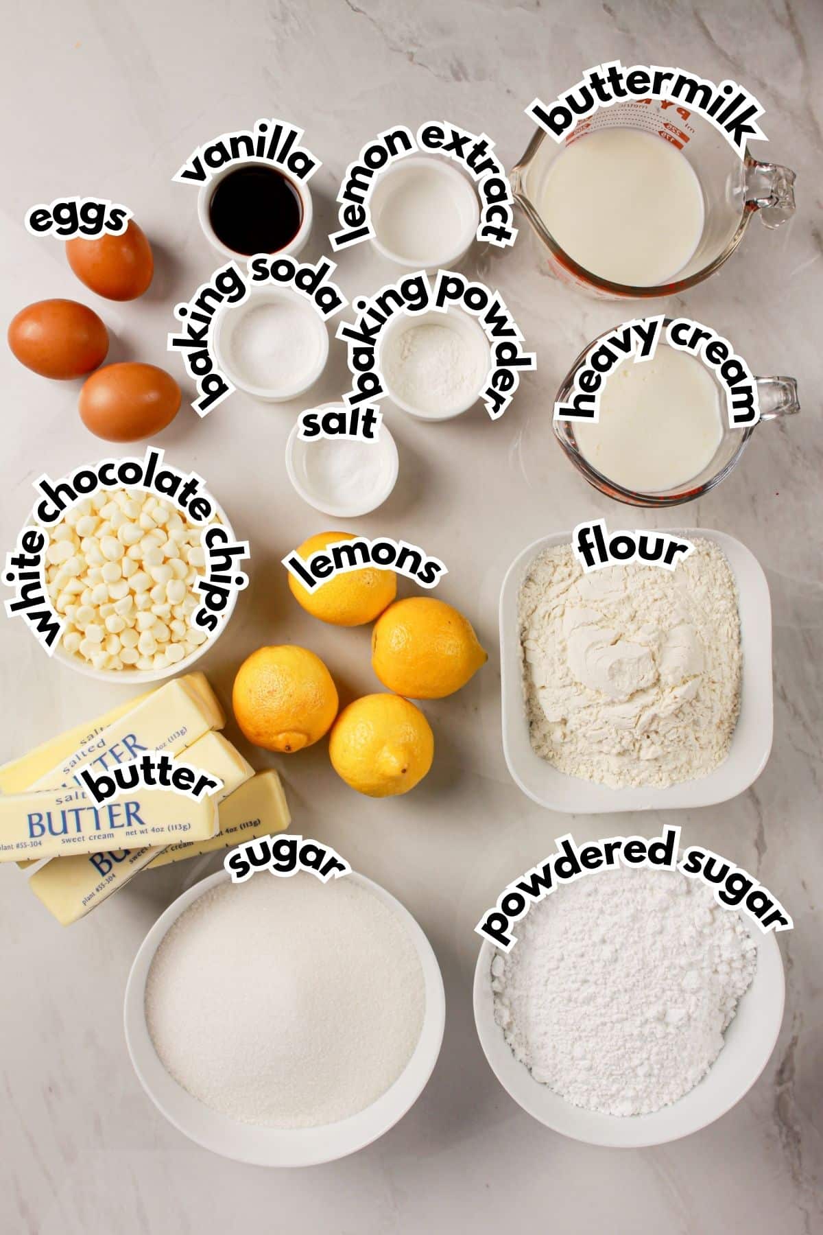 Bowls of ingredients labelled with text on a counter.