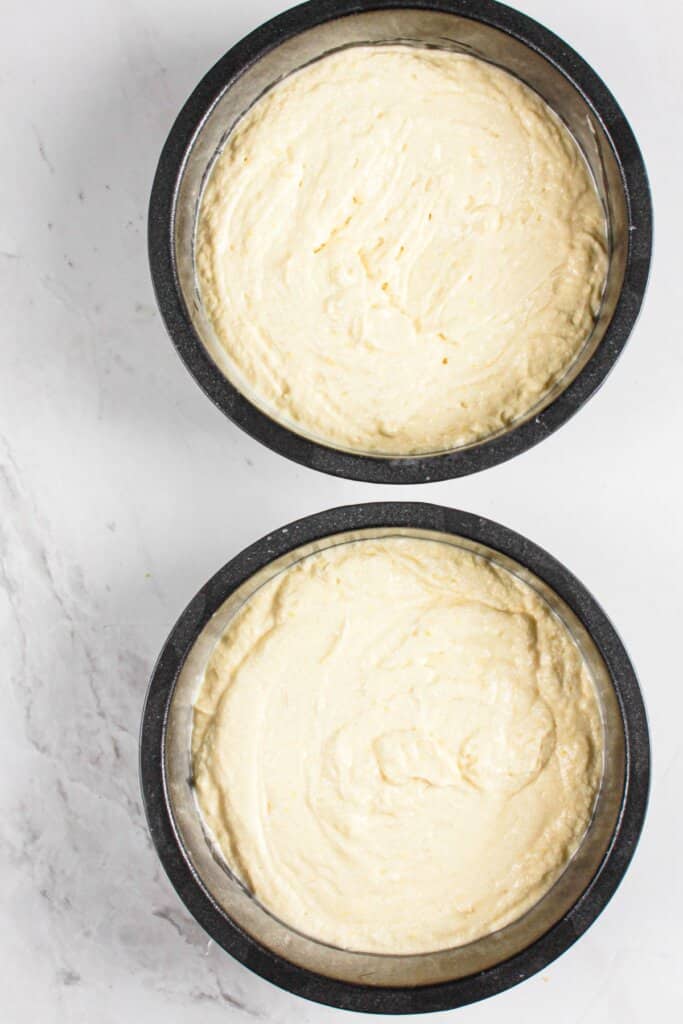 Batter in two round baking pans.