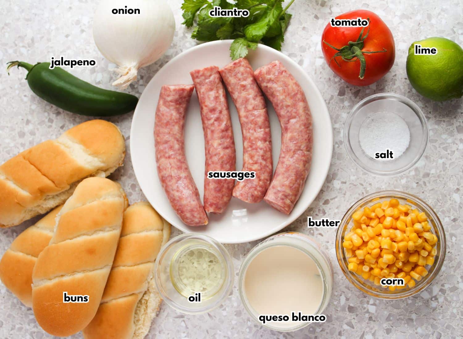 Ingredients for sausage dogs on a counter.