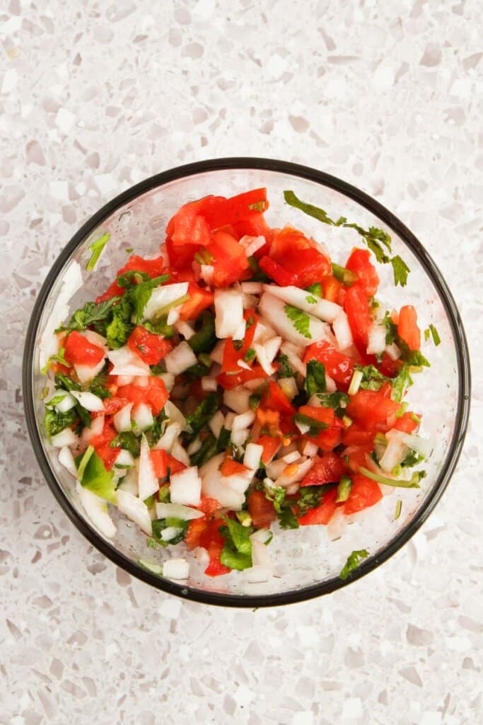 Pico de Gallo in a small glass bowl.