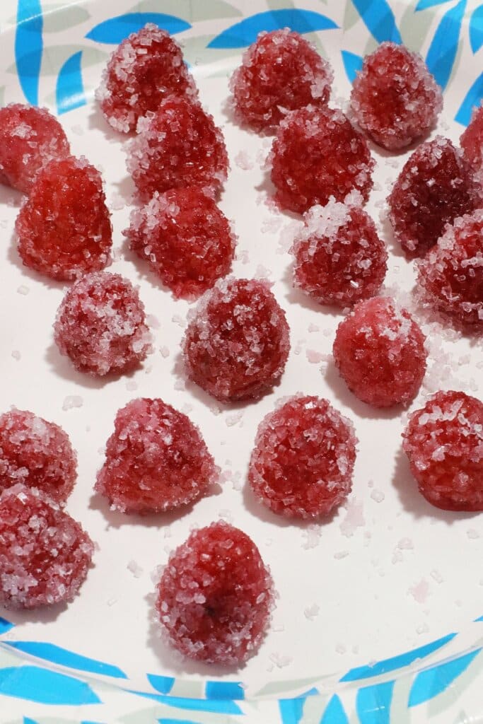 Raspberries on a paper plate.
