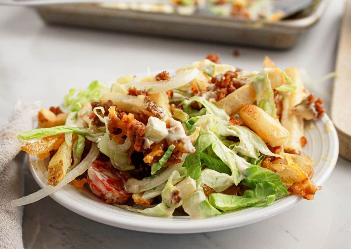 Plate full of big mac loaded fries.