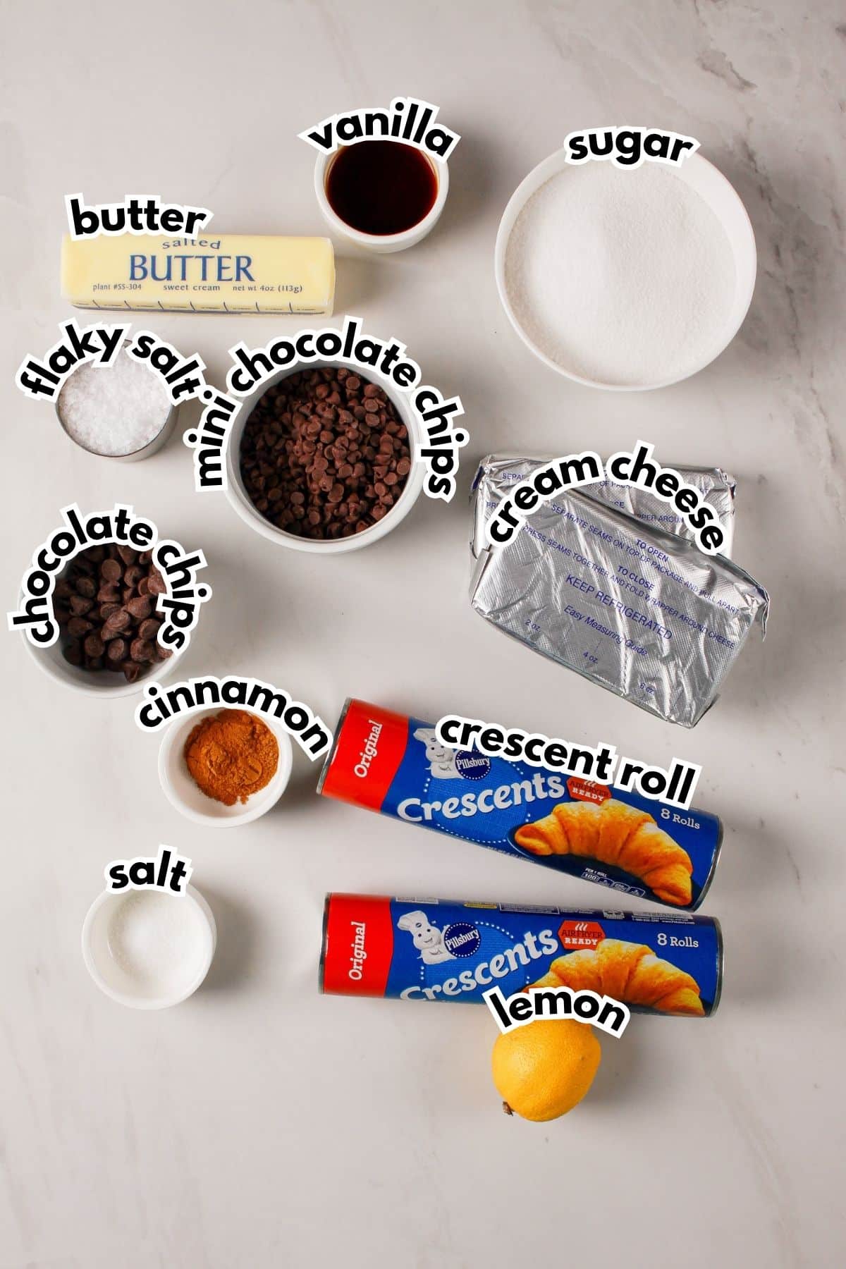 Bowls of ingredients labeled with text on a counter.