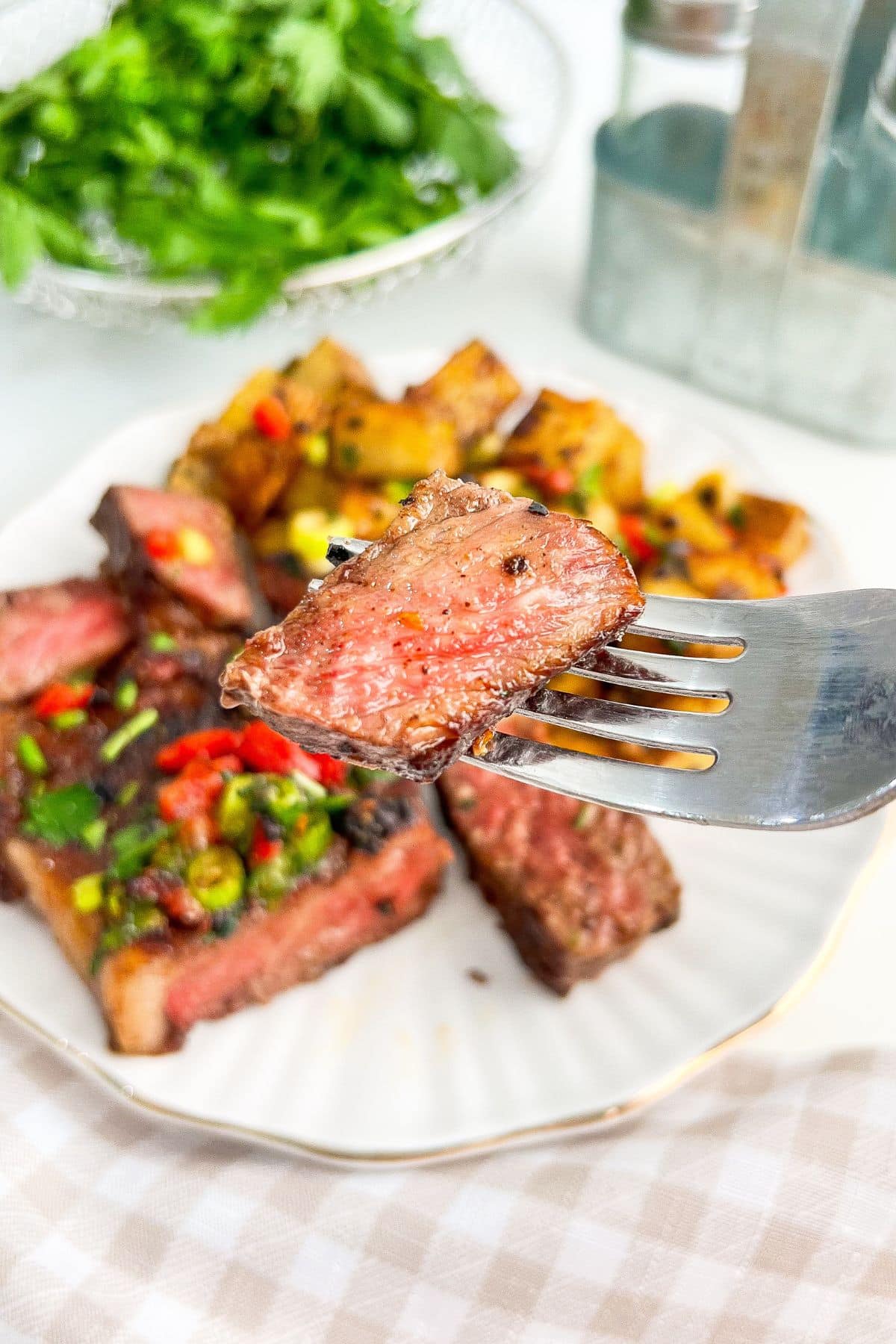Piece of steak on a plate.