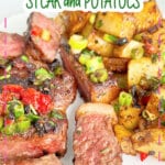 Steak and potatoes on a plate.
