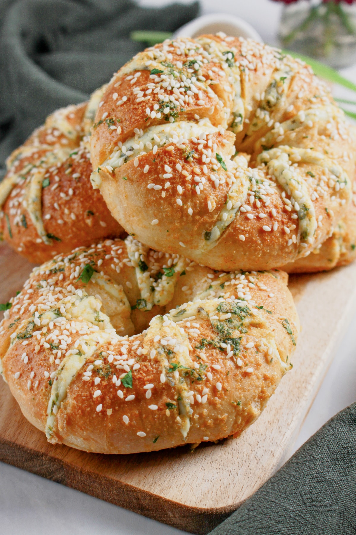 Bagels stacked on a serving platter.