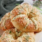 Bagels stacked on a serving platter.