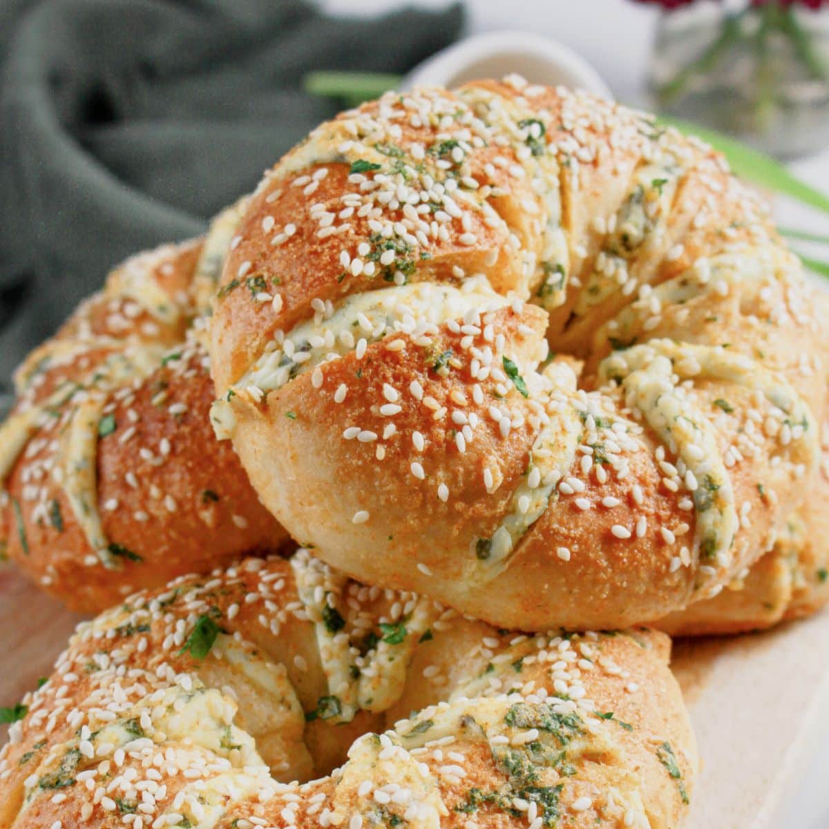 Bagels stacked on a serving platter.